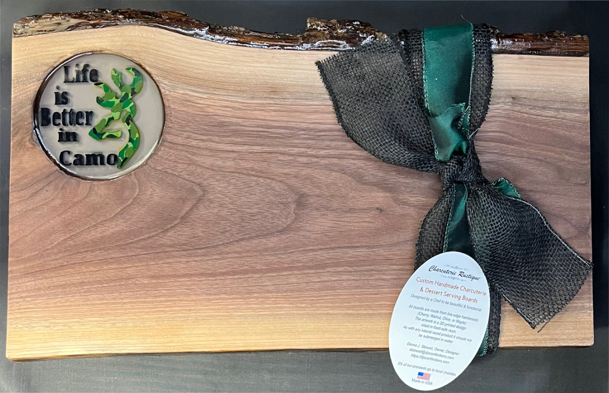 Walnut Live edge serving board with camo deer. Walnut Live edge serving board with camo deer.